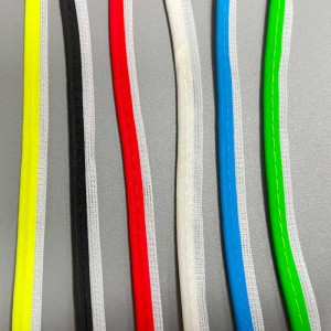 Colored reflective piping and binding tape